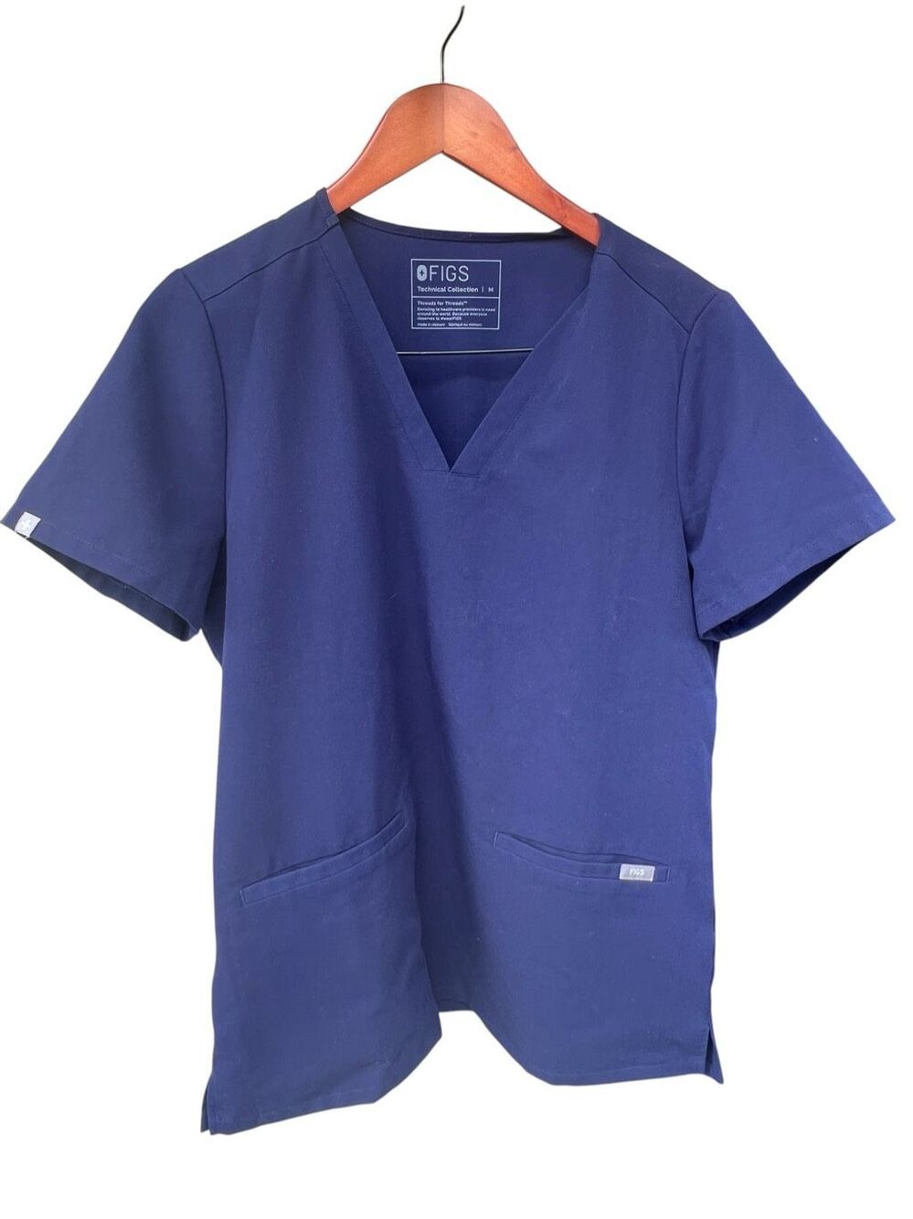 FIGS Casma Medium Three-Pocket Scrub Top navy blue V-neck short sleeves nurse